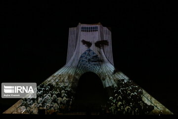 Azadi Tower lit, video mapped by memories of Islamic Revolution