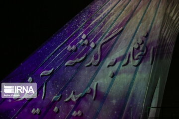 Azadi Tower lit, video mapped by memories of Islamic Revolution