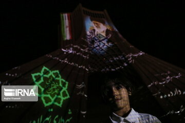 Azadi Tower lit, video mapped by memories of Islamic Revolution