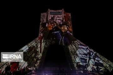 Azadi Tower lit, video mapped by memories of Islamic Revolution