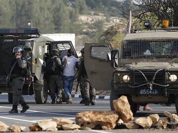 اشغالگران صهیونیست ۱۲ فلسطینی را در کرانه باختری بازداشت کردند