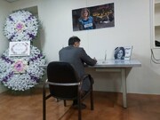 FM Spox signs Al-Jazeera reporter’s martyrdom memorial notebook