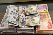 تحلیلگر عراقی: آمریکا از دلار به عنوان سلاح علیه دولت عراق استفاده می کند