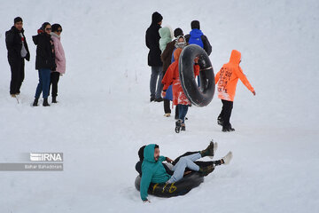 People in western Iran enjoy snowfall