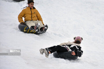 People in western Iran enjoy snowfall