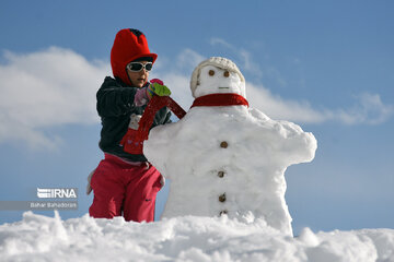 People in western Iran enjoy snowfall