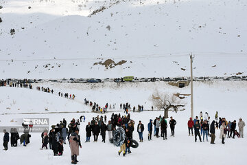 People in western Iran enjoy snowfall