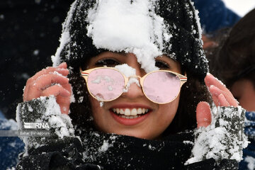 People in western Iran enjoy snowfall