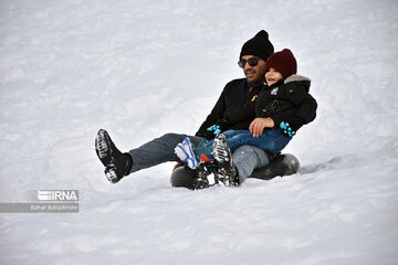 People in western Iran enjoy snowfall