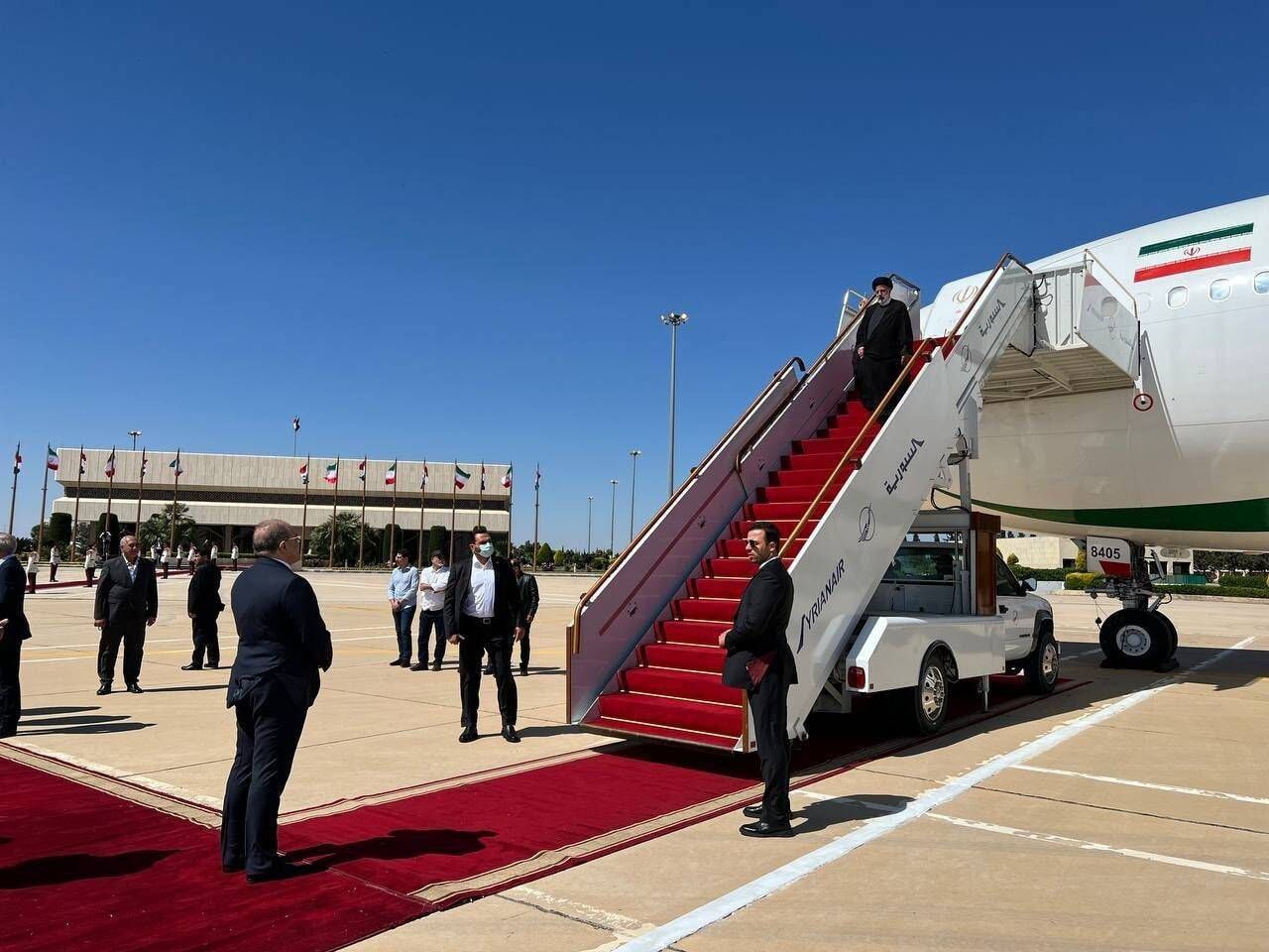 Iranian president arrives in Syria for historic visit