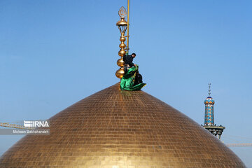 Replacement of flag of Imam Reza shrine in northeast Iran