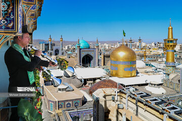 Replacement of flag of Imam Reza shrine in northeast Iran