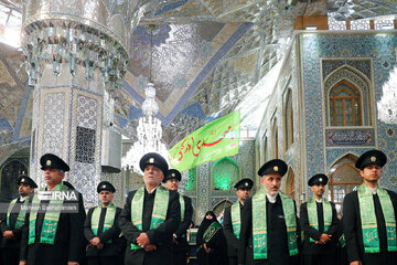 Replacement of flag of Imam Reza shrine in northeast Iran