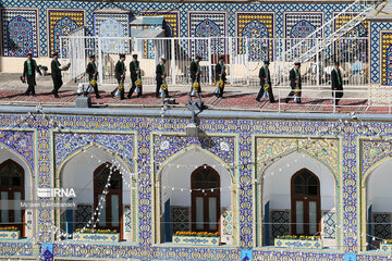 Replacement of flag of Imam Reza shrine in northeast Iran