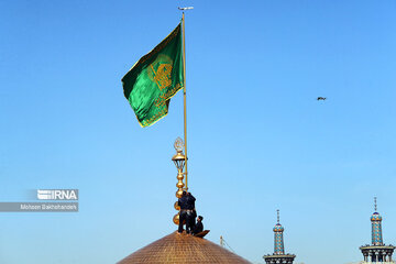 Replacement of flag of Imam Reza shrine in northeast Iran