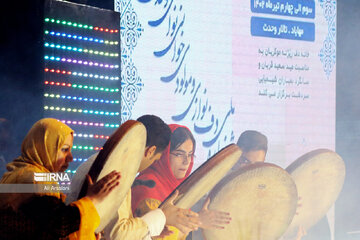 Playing traditional Daf Drum festival in western Iran