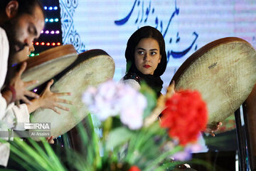 Playing traditional Daf Drum festival in western Iran