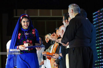 Playing traditional Daf Drum festival in western Iran