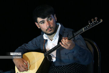 Playing traditional Daf Drum festival in western Iran