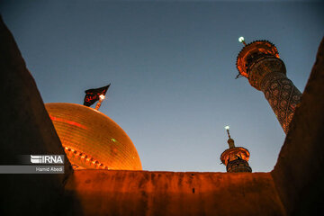 Flag of Hazrat Masoumeh shrine replaced to mourn for Imam Hussein