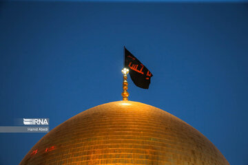 Flag of Hazrat Masoumeh shrine replaced to mourn for Imam Hussein