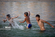 Children swimming in Isfahan's Naghsh-e Jahan