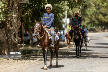 Horse riders on way to Imam Reza shrine