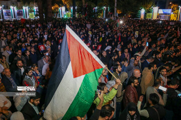 People gather in a square in Tehran to condemn Zionists’ crimes