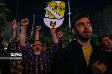 People gather in a square in Tehran to condemn Zionists’ crimes