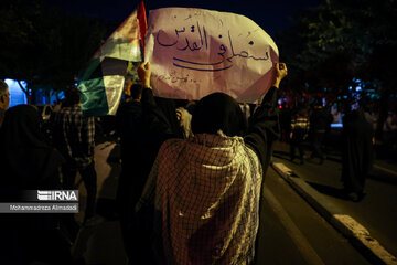 People gather in a square in Tehran to condemn Zionists’ crimes