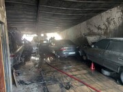 آتش گرفتن چند خودرو در تعمیرگاهی در تهران+فیلم