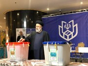 President Raisi casts his ballot