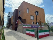 Building of Iranian caravan for Paris Olympics decorated with nat’l flags