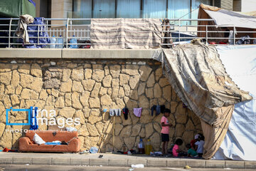 War-hit people of southern Lebanon on coast of Beirut