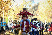 People enjoying colorful autumn in western Iran