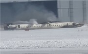 At least 18 injured after plane flips on landing in Toronto