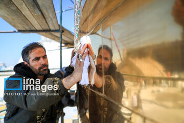 In photos: Imam Reza shrine dome washed ahead of Nowruz