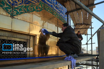 In photos: Imam Reza shrine dome washed ahead of Nowruz