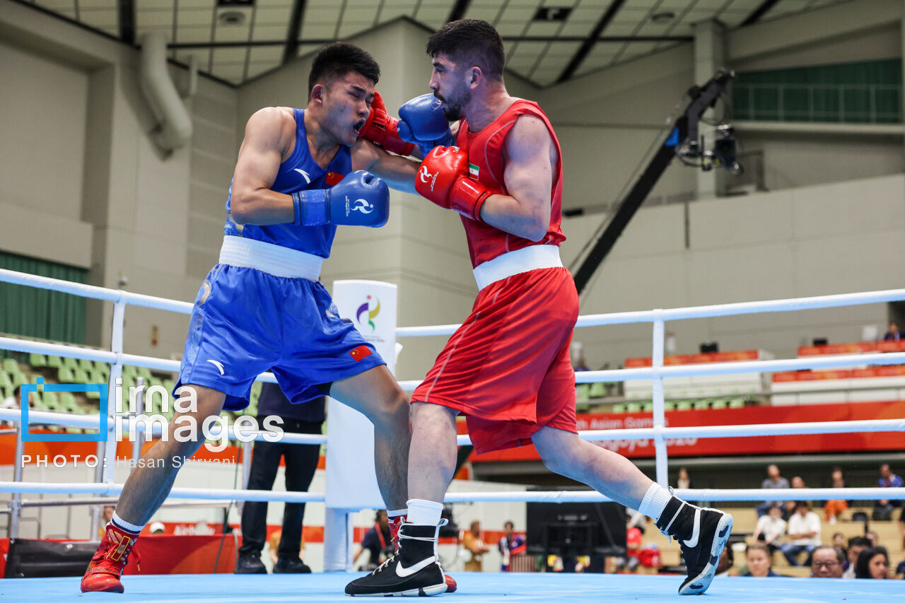 Update: In photos: Iranian boxer faces Chinese competitor at Asian Games opener