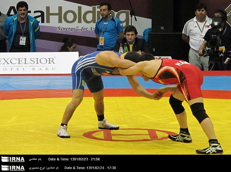 (photo)Iran's National Free Style Wrestling Team defeat American rivals in Baku to reach finals