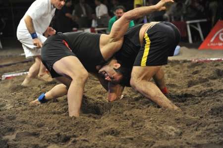 Iran wins world title in beach wrestling