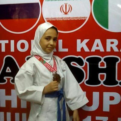 Iranian teenager receives karate gold Iranian teenager receives karate gold