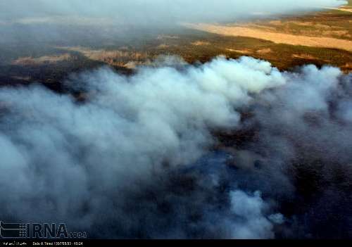 Extinguishing fire in Hoor al-Azim lagoon